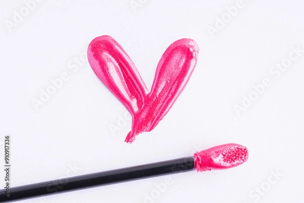 Obraz Pink liquid lipstick and applicator isolated on white background. Swatch of deep pink lip gloss. Top view, flat lay, copy space