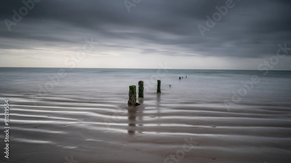 Obraz Youghal Strand Groynes on a warm summer morning just before the rain comes
