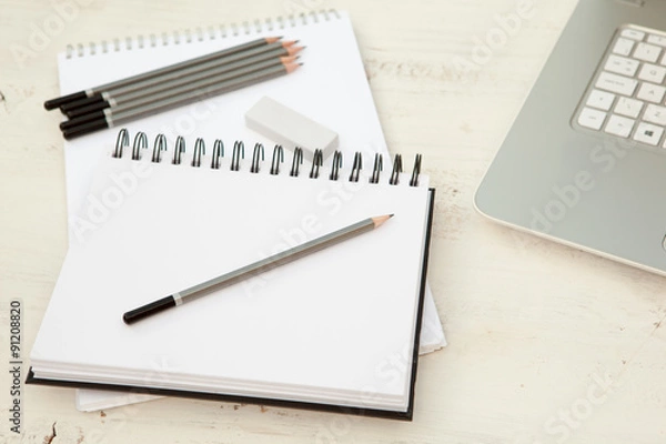 Obraz Two sketchpads, pencils and eraser on the white wooden table