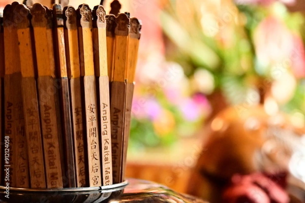 Fototapeta Taiwan - Jul 09, 2024: Close-up of divination tubes at Anping Kaitai Tianhou Temple, where worshippers seek spiritual guidance through fortune-telling and divine communication.