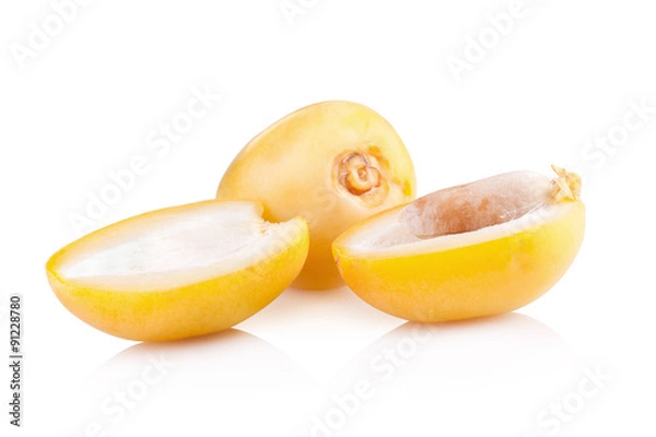 Fototapeta yellow raw dates isolated on white background