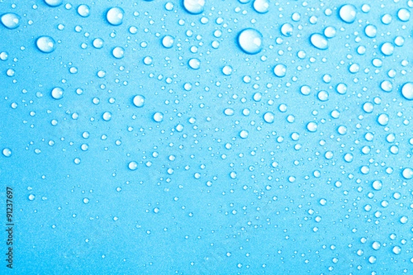 Obraz Drops of water on a color background. Blue. Shallow depth of fie