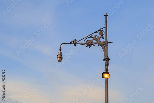 Fototapeta Street lamp and blue sky in the background 