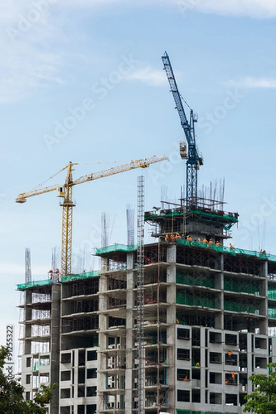 Fototapeta Building crane and building under construction