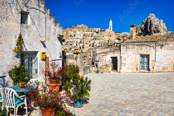 Fototapeta Panoramic view of the ancient town of Matera (Sassi di Matera) in a beautiful autumn day, Basilicata, southern Italy. Stunning view of the village of Matera. Matera is a city on a rocky outcrop.