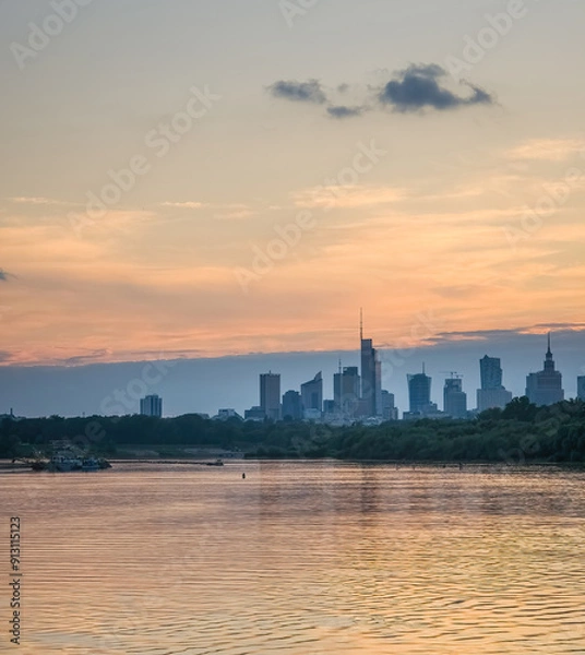 Obraz Warsaw skyline seen from the perspective of Vistula river in the colorful sunset.
