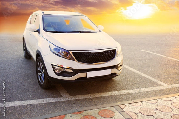 Fototapeta crossover on parking against sunset