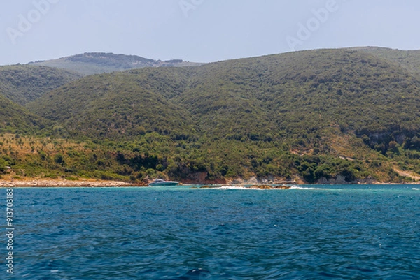 Fototapeta The peninsula Karaburun in Albania near the city of Vlore. A touristic hotspots for daytrips to swim in the crystal clear waters and it marks the border between the Adriatic and Ionian seas