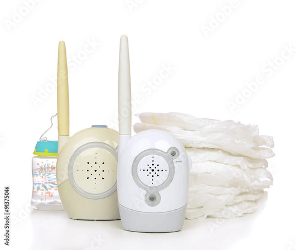 Fototapeta Child baby kid radio monitor device stack of diapers with baby f