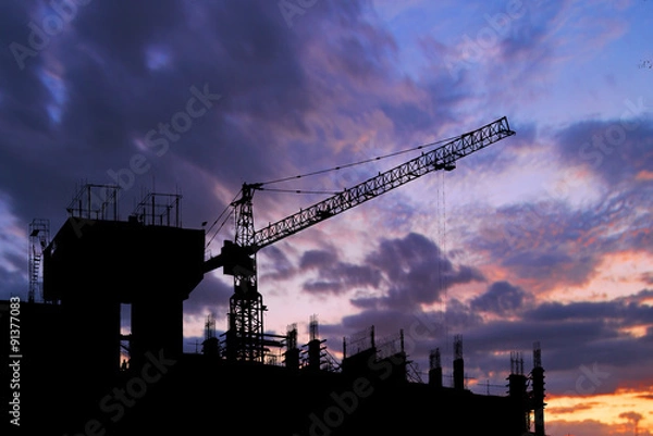 Fototapeta Construction crane on tower