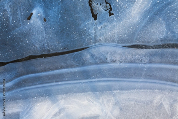 Obraz A close-up of ice, revealing intricate crystalline patterns and textures