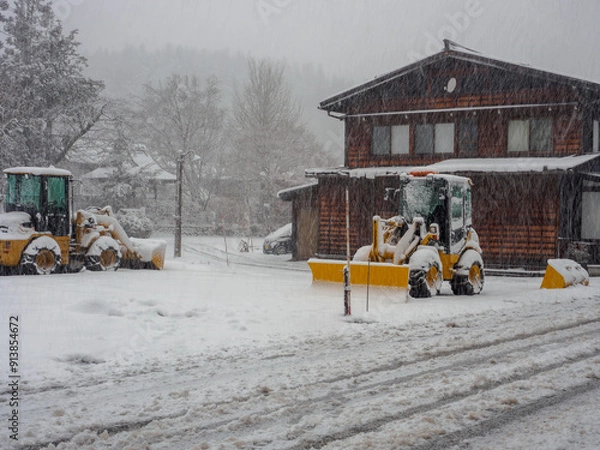 Obraz Truck for snow digger at Shirakawa-go, a small traditional village showcasing a building style known  It's UNESCO's World Heritage Sites on Dec 10, 2018.