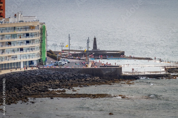 Fototapeta Seascape. Calm sea. Sunset at sea. Views of the village of Bajamar and natural pools. Tenerife, Bajamar, Canary Islands.