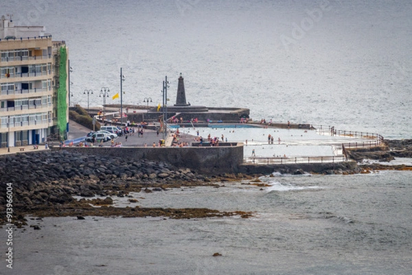 Obraz Seascape. Calm sea. Sunset at sea. Views of the village of Bajamar and natural pools. Tenerife, Bajamar, Canary Islands.
