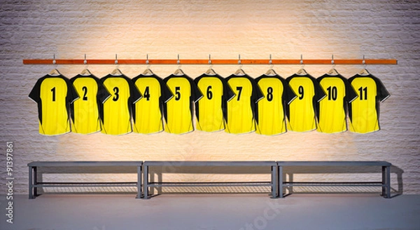 Obraz Row of Yellow Football Shirts hanging on Wall in Changing Room with Bench