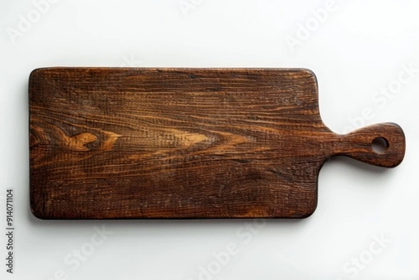 Fototapeta High angle view of dark brown rectangular wooden background with handle on top right isolated on white with soft shadows