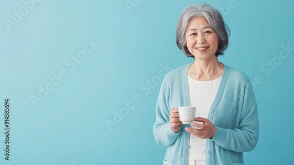 Fototapeta カーディガンと白いブラウスの日本人女性 