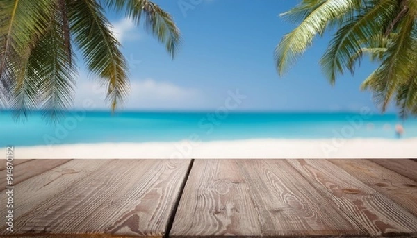 Obraz Polished wooden table for product display with a smooth, blurred background of a tropical beach with palm trees