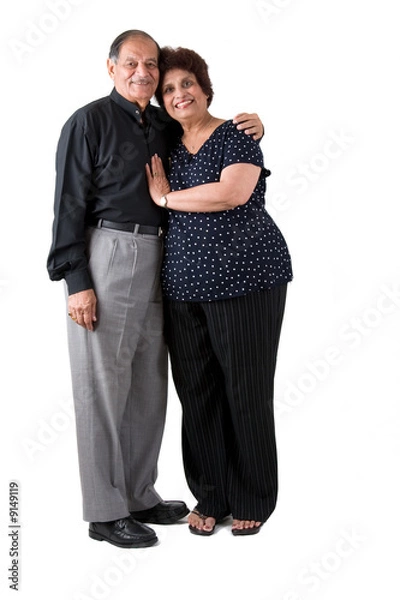Fototapeta Portrait of a happy elderly East Indian couple