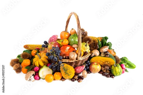 Fototapeta Autumn harvest - fresh autumn fruits and vegetables in wicker basket on white background