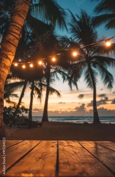 Obraz Sunset Serenity at the Beach with String Lights and Palm Trees, Wooden Table Foreground, Evoking a Tranquil and Romantic Tropical Evening