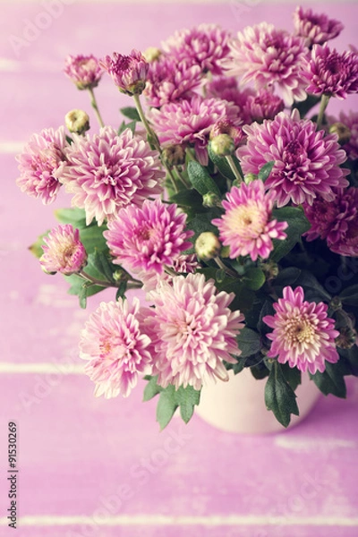 Obraz Beautiful purple chrysanthemum flowers on wooden table, closeup
