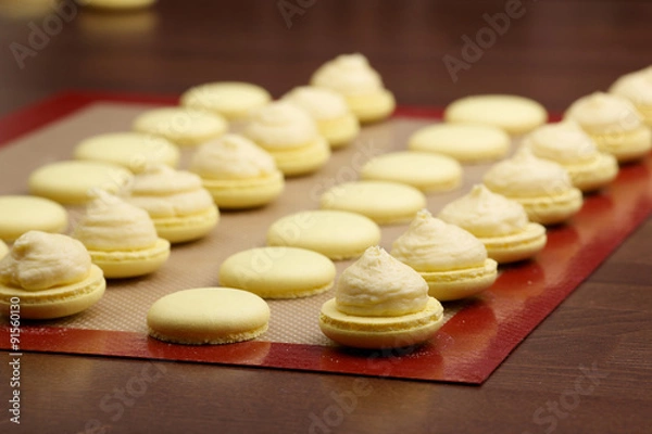 Obraz macaroon halves coated with cream