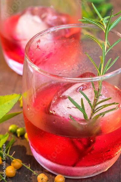 Obraz Glasses of refreshment raspberry flavor fizz with ice and rosema