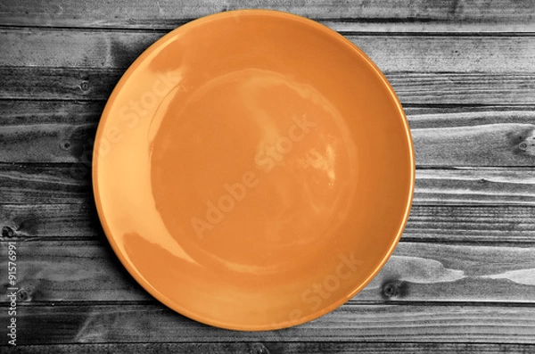 Obraz Orange plate on table