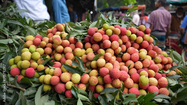 Obraz Freshly picked ripe lychees, ready for sale at the market. Vibrant colors and juicy sweetness of this tropical delight, straight from the orchard to your table. Lychee, Litchi, Lichee, fruit