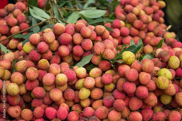 Obraz Freshly picked ripe lychees, ready for sale at the market. Vibrant colors and juicy sweetness of this tropical delight, straight from the orchard to your table. Lychee, Litchi, Lichee, fruit