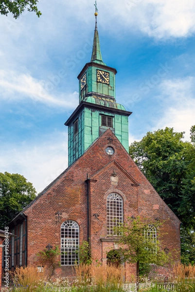 Fototapeta The Evangelical Lutheran Church in Nienstedten, Hamburg, Germany. The parish of Nienstedten was probably founded in the late 12th century and was first mentioned in 1297. Rebuilt in 1750/51