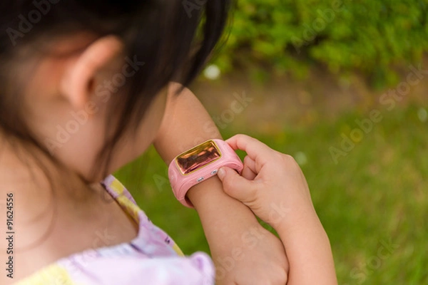 Fototapeta Child Using Smartwatch or Smart Watch / Child with Smartwatch or Smart Watch