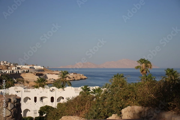Fototapeta View of the Red Sea and Tiran Island in Sharm El Sheikh. White villas and hotels against the backdrop of the sea.