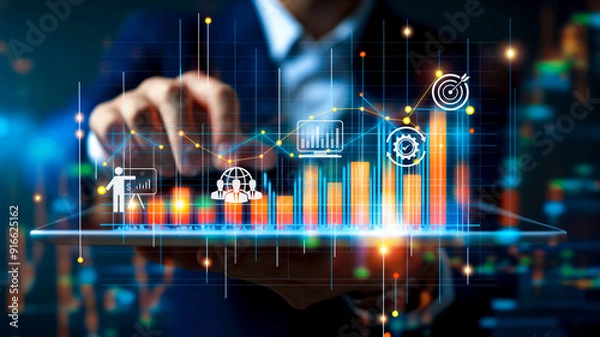 Obraz A business professional interacts with a digital screen displaying financial analytics and growth charts. The image highlights the use of advanced technology in business analysis and decision-making.