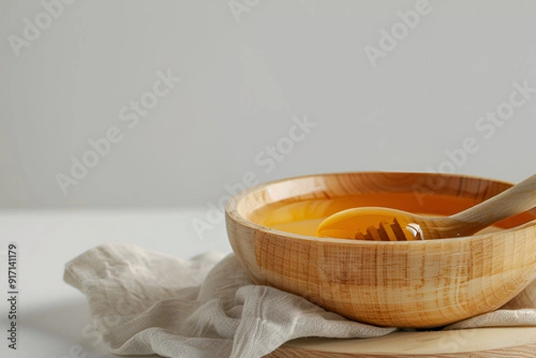 Obraz Wooden bowl with honey and dipper
