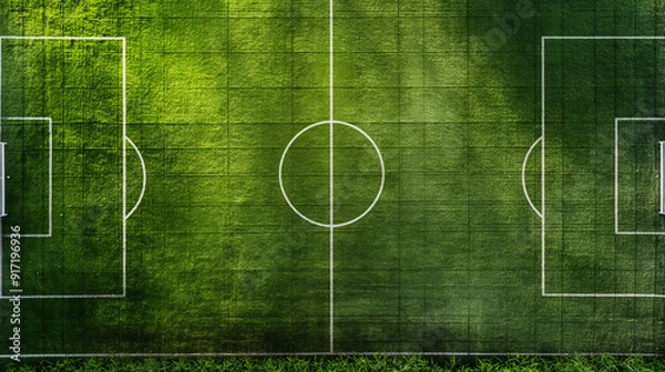 Fototapeta The vibrant green soccer field features clear white lines and two goals, bathed in bright sunlight