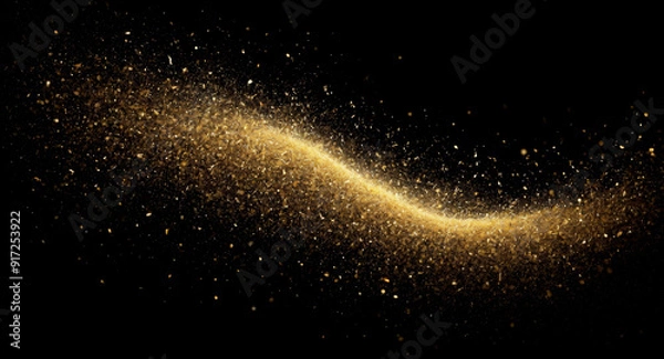 Fototapeta Golden particles falling from above, creating a sparkling and luxurious atmosphere on a dark background. Ideal for festive, celebratory, or luxury-themed designs and creative projects.