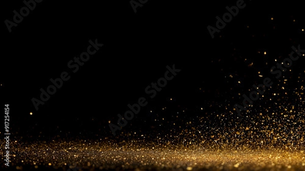 Fototapeta Golden particles falling from above, creating a sparkling and luxurious atmosphere on a dark background. Ideal for festive, celebratory, or luxury-themed designs and creative projects.