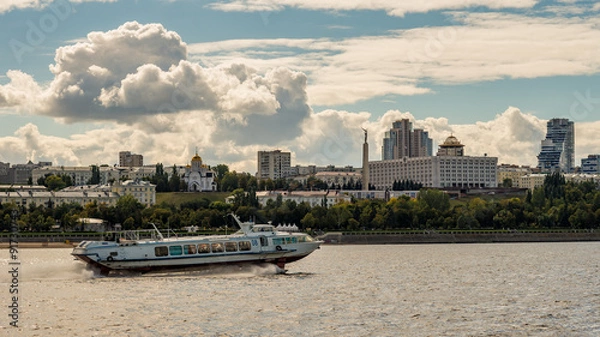 Fototapeta Hydrofoil ship sails in front of beaches of the city of Samara o