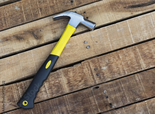 Fototapeta Hammer with clipping path on wooden table