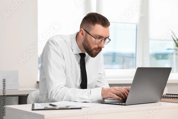 Obraz Man with poor posture working in office