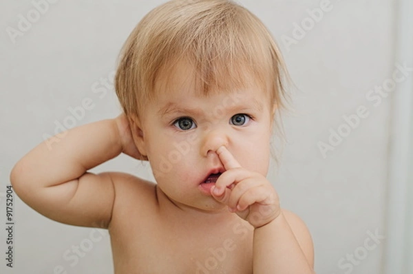 Fototapeta child portrait picking his nose