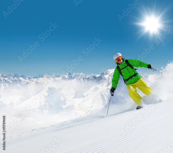 Obraz Man skier running downhill