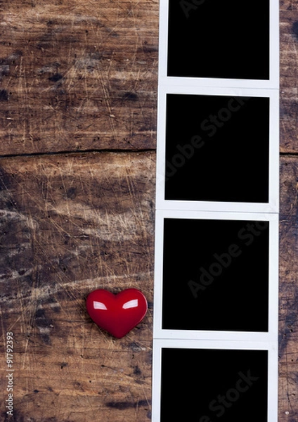 Obraz Heart and photo frame on old wooden desk