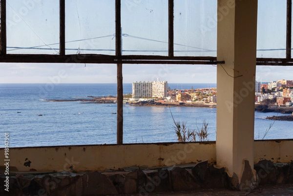 Fototapeta Abandoned hotel. Hotel Neptuno. Stairs, broken door, big tree and swimming pool in the background. Tenerife, Bajamar, Canary Islands.