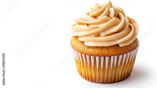 Obraz Closeup of a peanut butter swirl cupcake with frosting, isolated on a white background, highlighting the detailed texture 