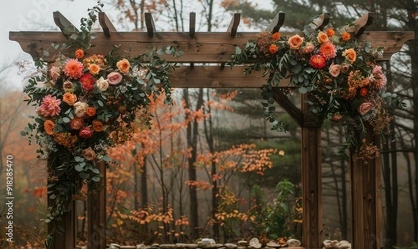 Fototapeta Wooden frames with floral arrangements creating a rustic wedding backdrop