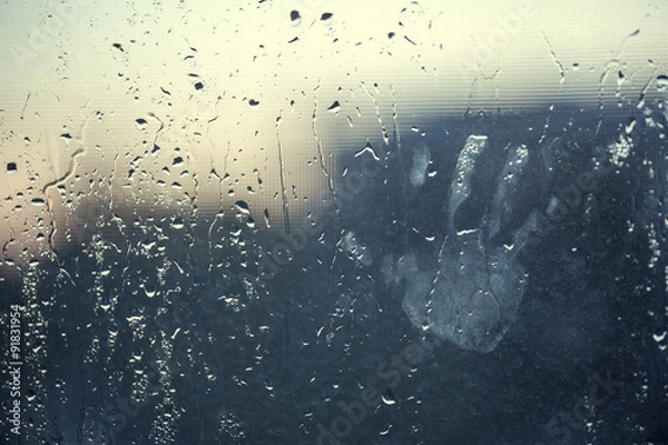 Fototapeta water drops background with chid's hand