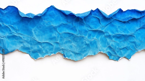 Fototapeta A torn piece of paper with a vibrant blue color at the top. The paper appears to be crumpled and has a rough texture. The blue portion is wavy, suggesting the paper might have been subjected